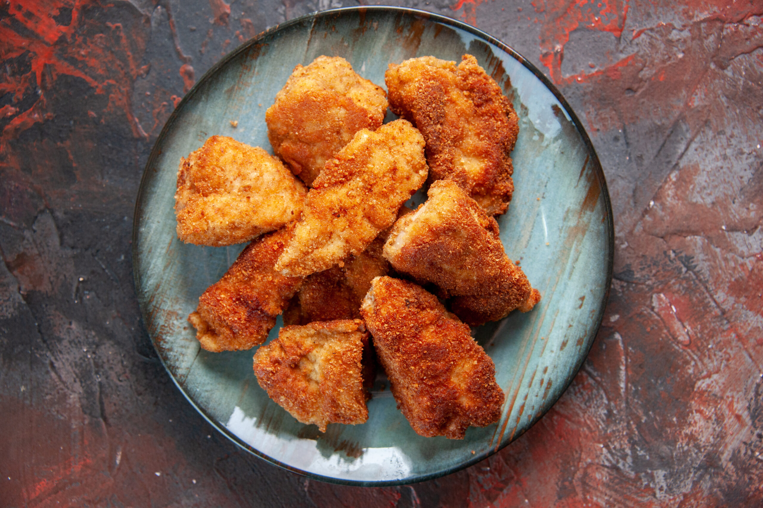 top-view-tasty-chicken-wings-inside-plate-dark-surface-dinner-burger-food-fries-meat-lunch-sandwich-meal